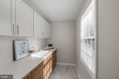 a bedroom with a bed and painting on the wall