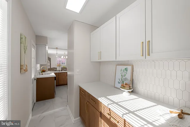 a kitchen with stainless steel appliances a stove a microwave and cabinets