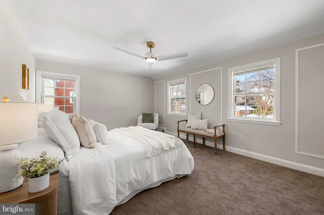 a bedroom with bed and window