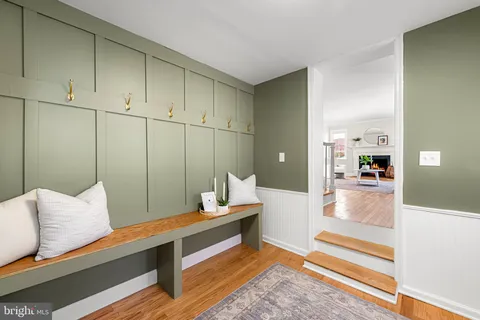 a living room with furniture a rug and a large window