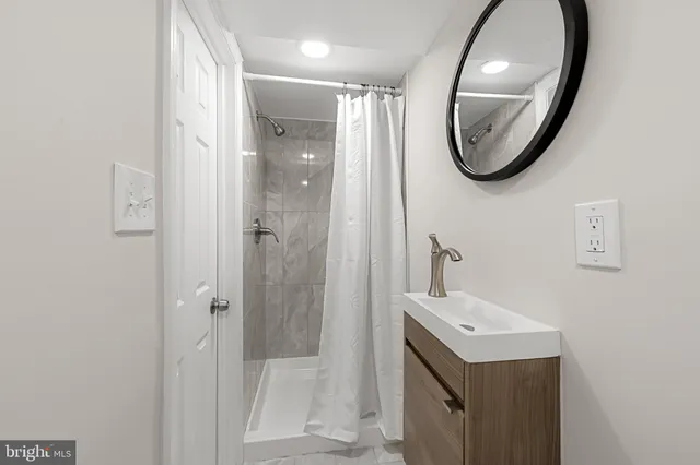 a view of a yard with plants and trees