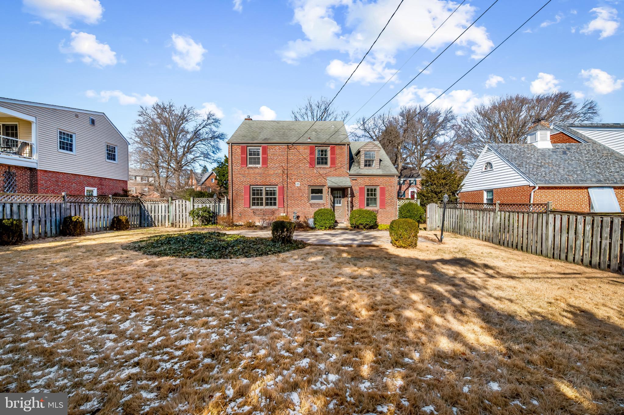 517 Worcester Road Towson, MD 21286 - Photo 34 of 44 a front view of a building with a yard