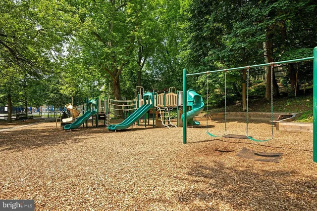 a view of swimming pool with outdoor seating and plants