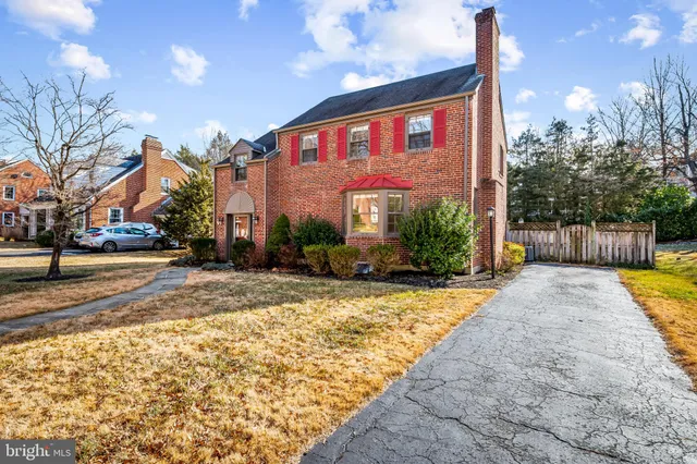 a swimming pool with outdoor seating and trees