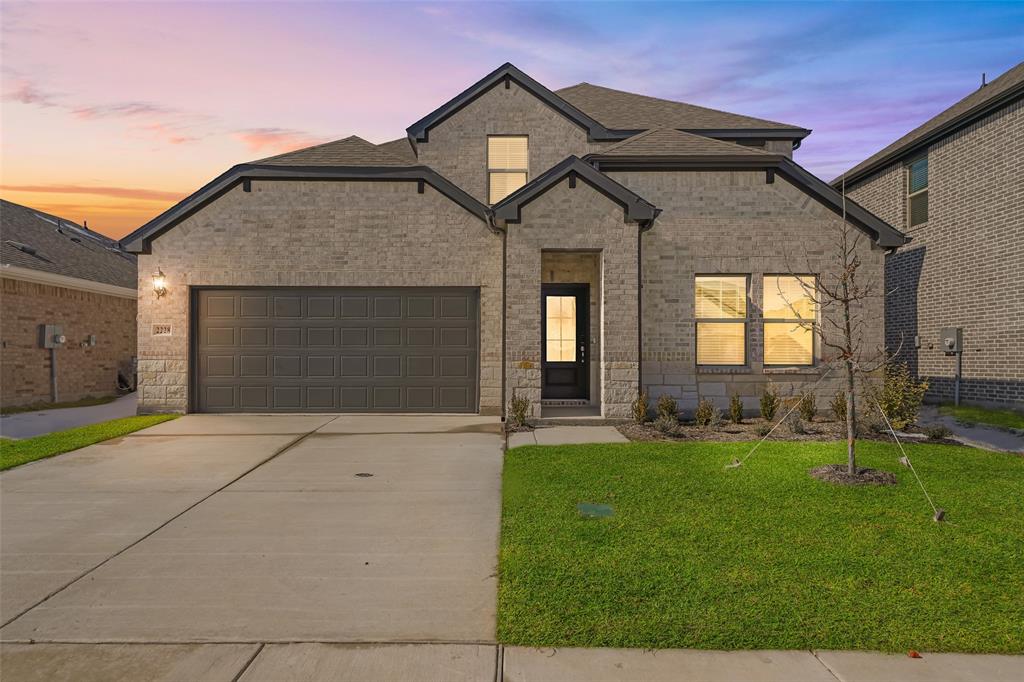 front view of a house with a yard