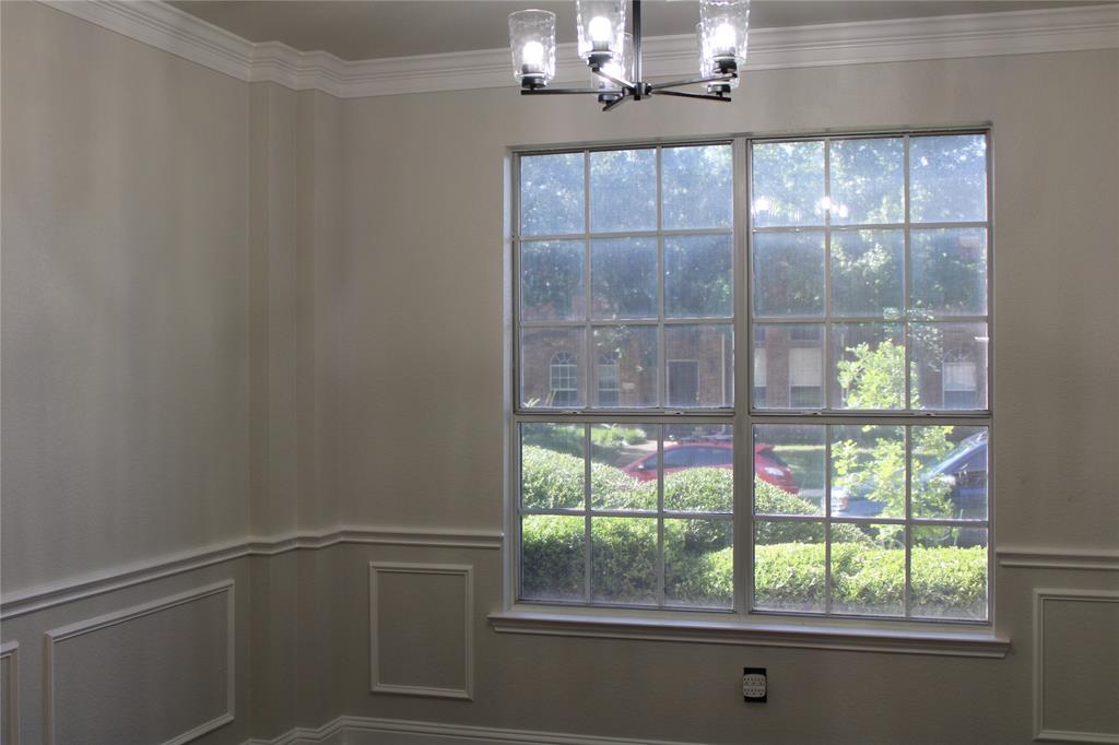 8905 Lakepointe Avenue Rowlett, TX 75088 - Photo 21 of 27 Detailed view of a chandelier and crown molding