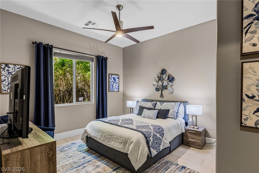 10167 Copper Edge Road Las Vegas, NV 89148 - Photo 23 of 45 Relaxing sleeping quarters with ample natural light and high ceilings for serene comfort.