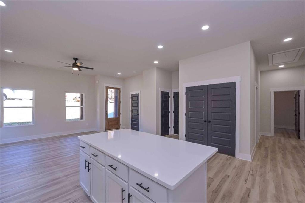 80 Rosemary Way Buchanan, GA 30113 - Photo 11 of 20 a kitchen with kitchen island a sink dishwasher and a large refrigerator
