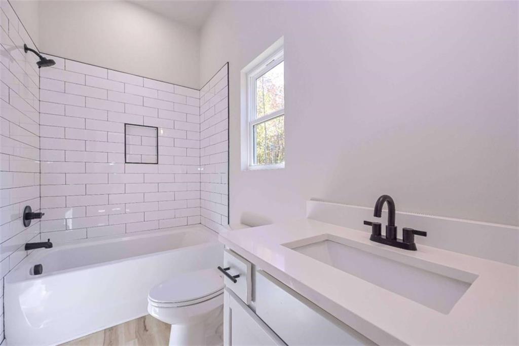 80 Rosemary Way Buchanan, GA 30113 - Photo 14 of 20 a bathroom with a sink a toilet and bathtub