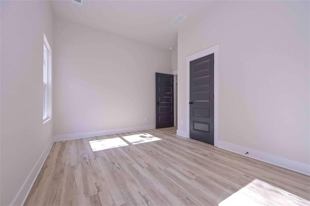 80 Rosemary Way Buchanan, GA 30113 - Photo 17 of 20 a view of an empty room with wooden floor