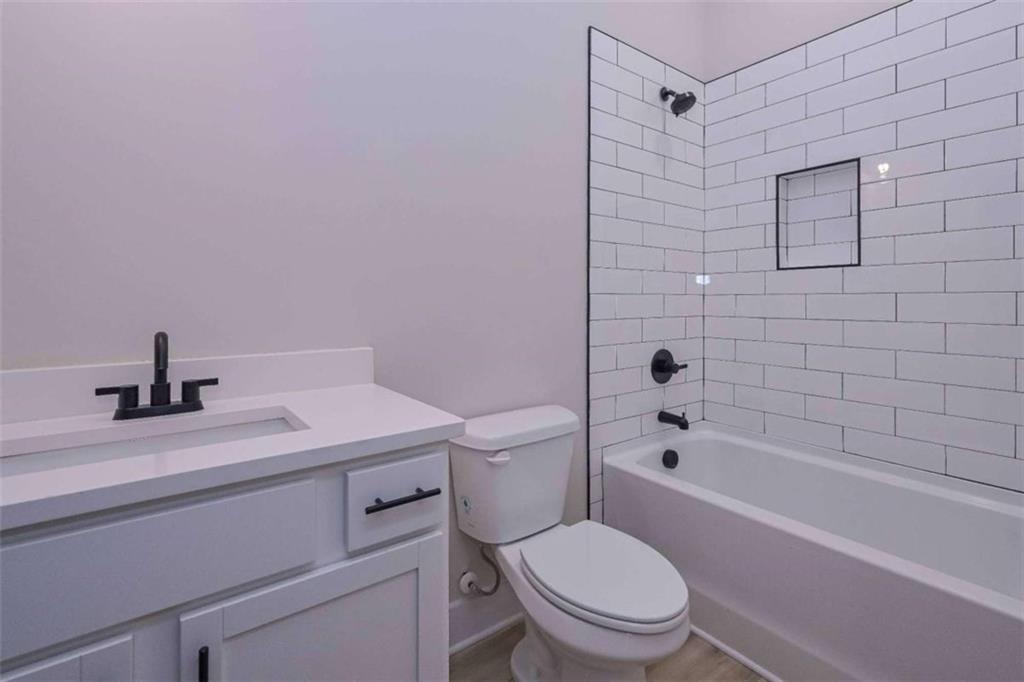 80 Rosemary Way Buchanan, GA 30113 - Photo 20 of 20 a bathroom with a sink a toilet and shower