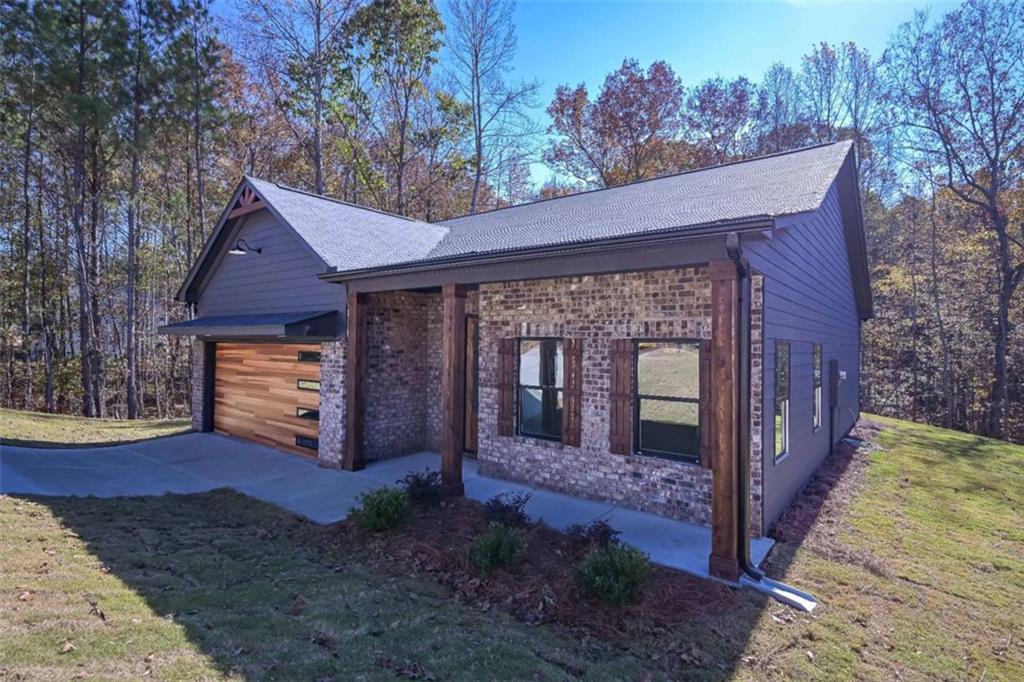 80 Rosemary Way Buchanan, GA 30113 - Photo 3 of 20 a front view of a house with garden