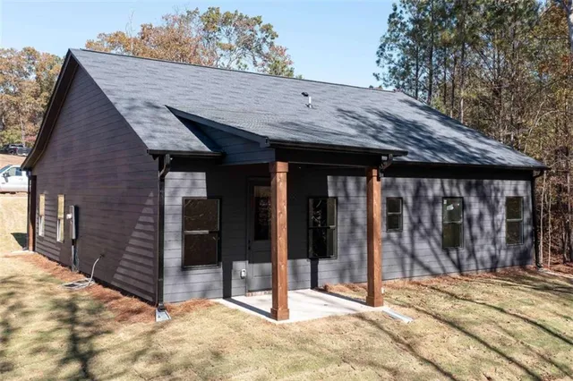 a view of a kitchen with a sink and a refrigerator