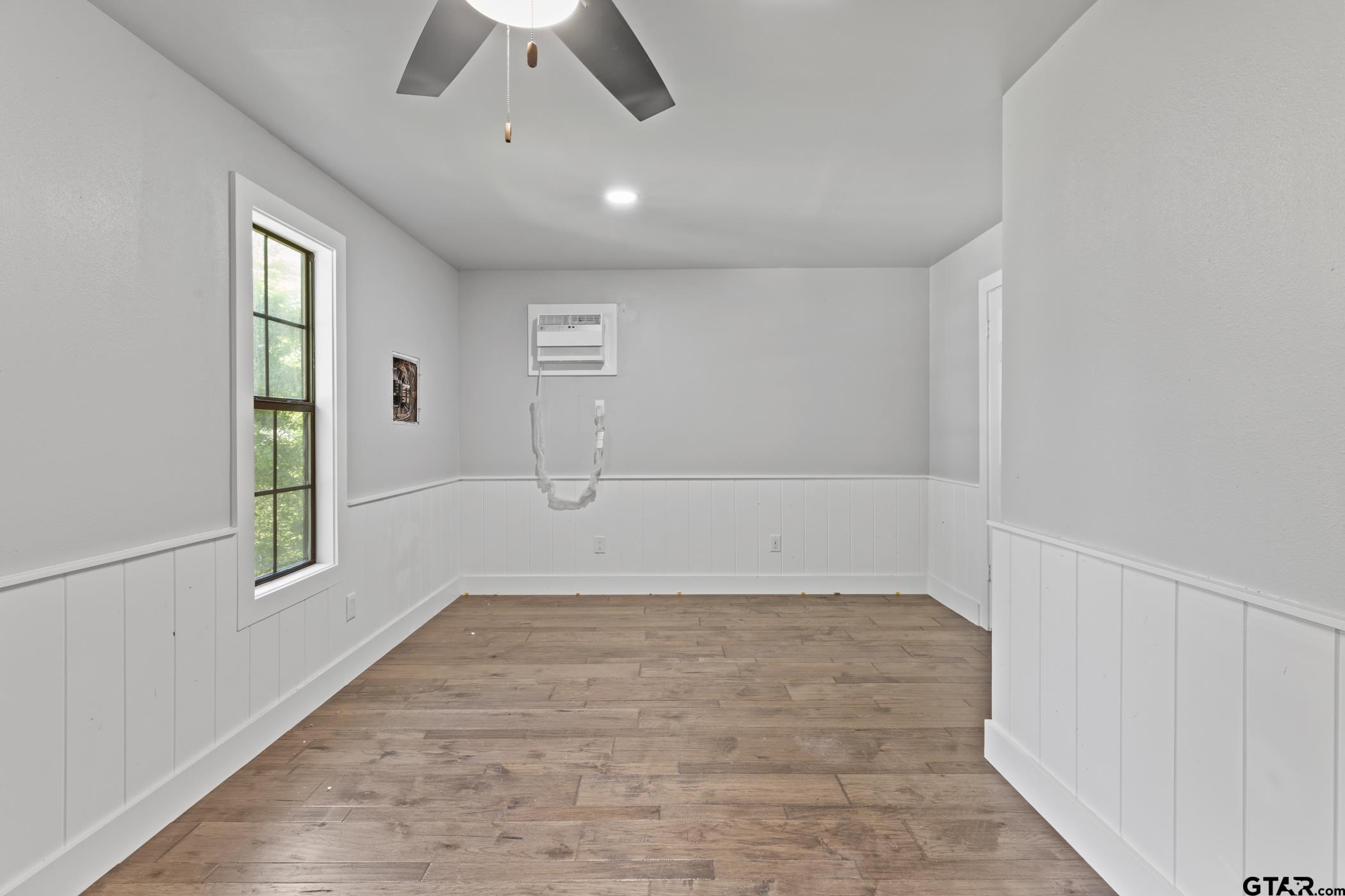 18630 Eastside Road Troup, TX 75789 - Photo 9 of 47 wooden floor in an empty room with a window