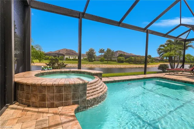 a view of a swimming pool with a yard
