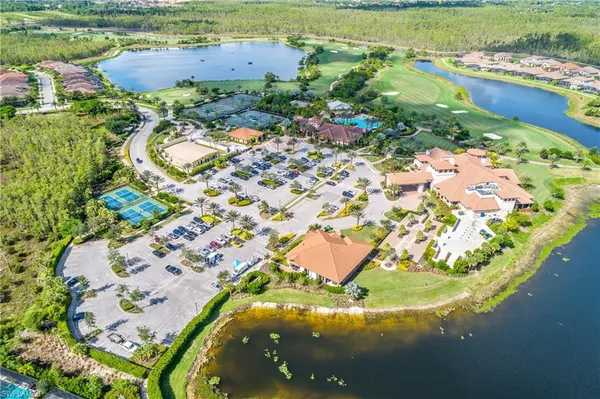 an aerial view of a house with a lake view