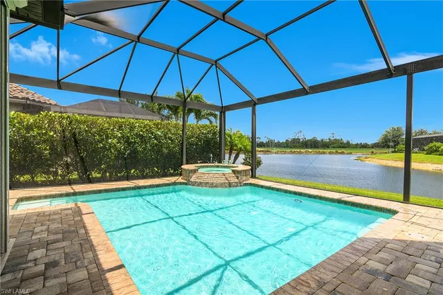 a view of a swimming pool with a patio