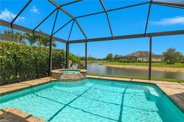 a view of a swimming pool with a patio