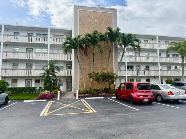 a view of a cars parked in front of a building