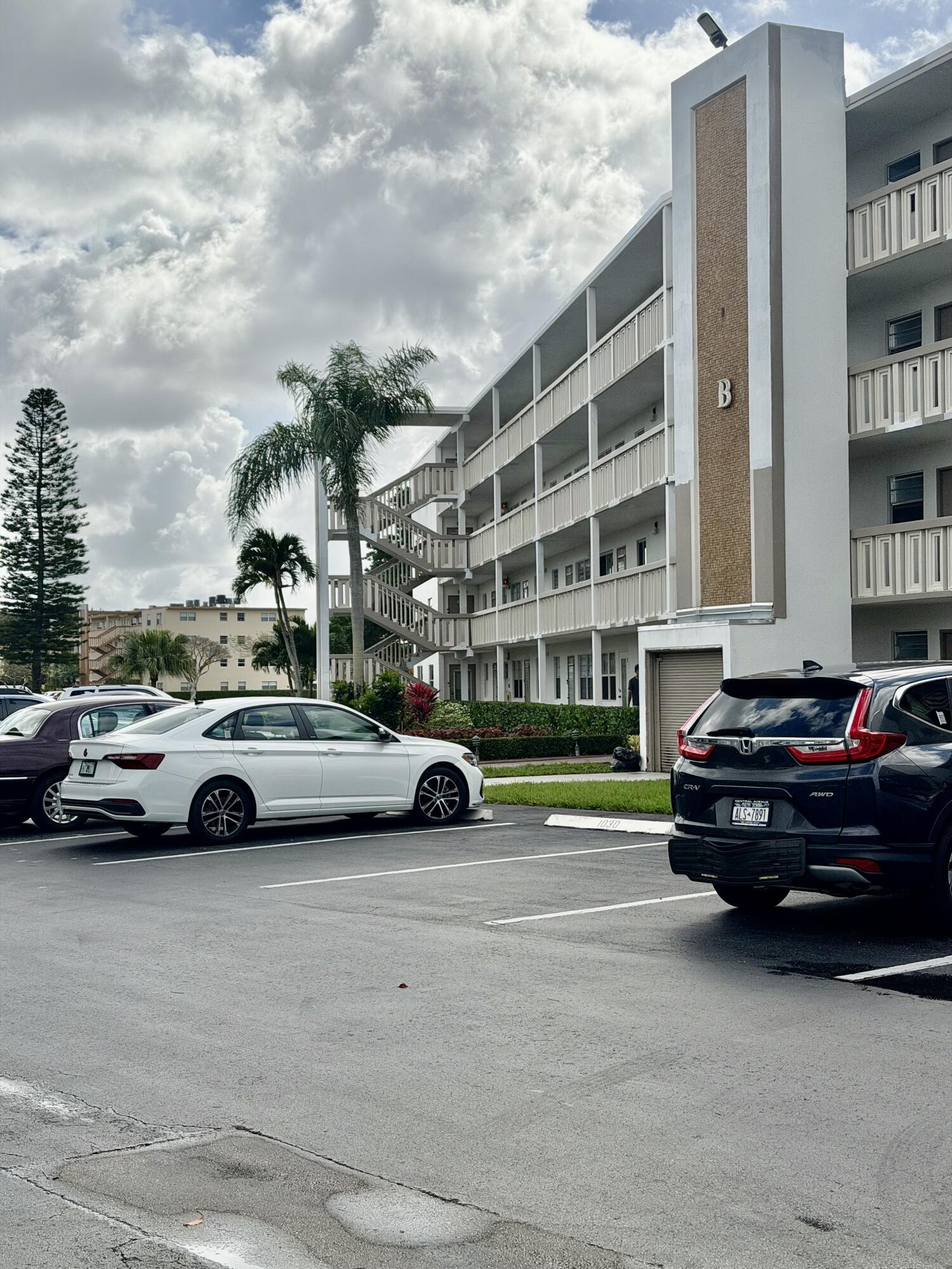 3035 Rexford A Boca Raton, FL 33434 - Photo 2 of 8 a view of street with parked cars