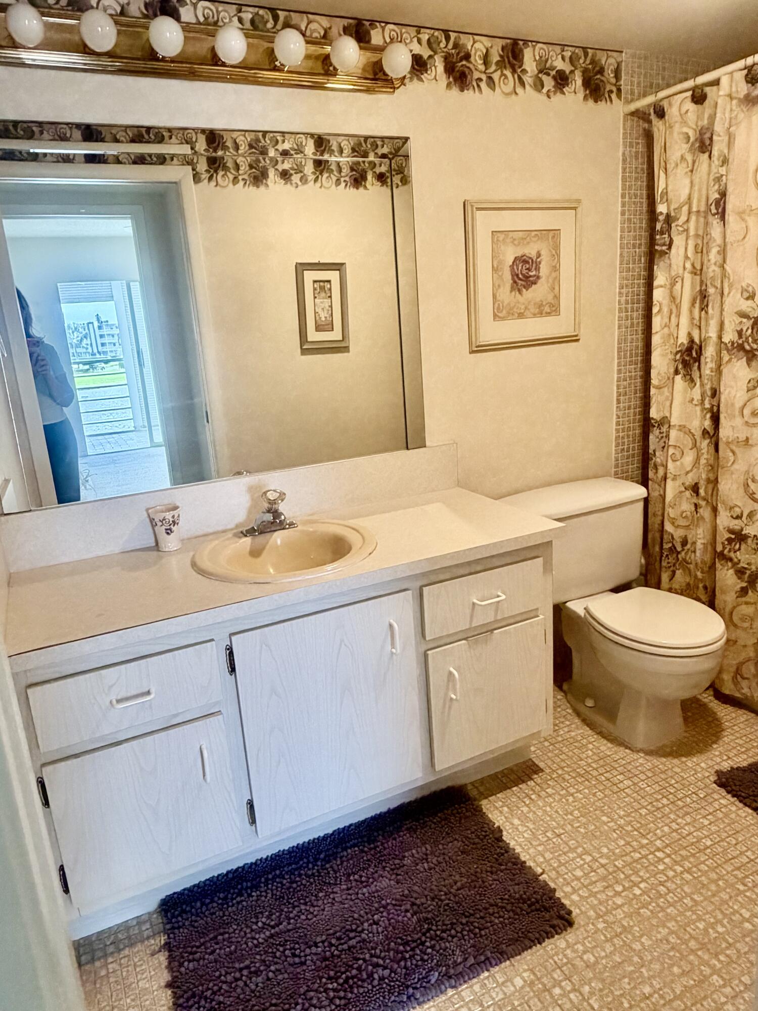 3035 Rexford A Boca Raton, FL 33434 - Photo 5 of 8 a spacious bathroom with a granite countertop sink toilet and a mirror