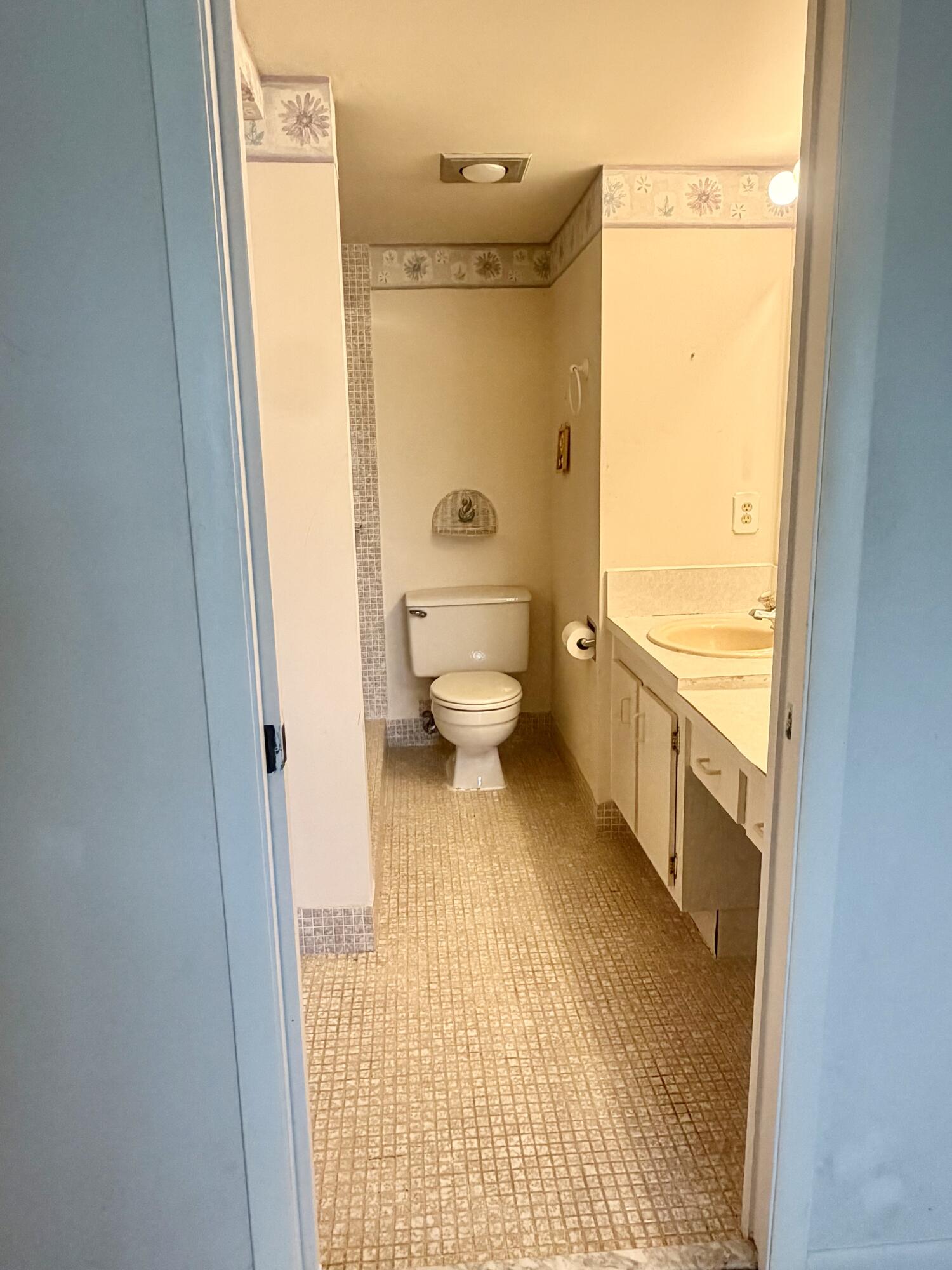 3035 Rexford A Boca Raton, FL 33434 - Photo 6 of 8 a bathroom with a toilet and a shower