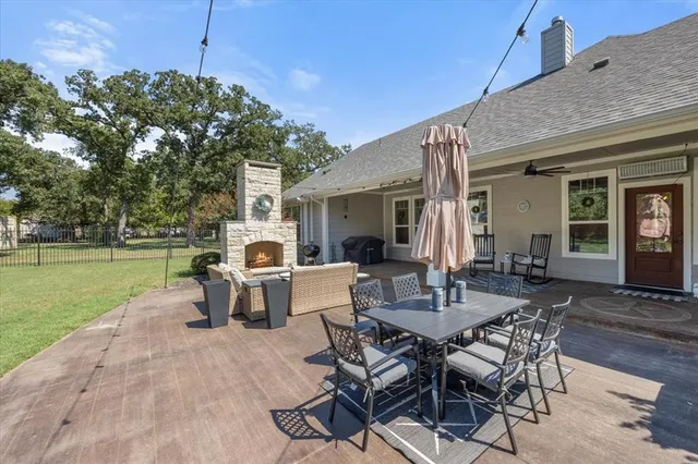 a patio with table and chairs