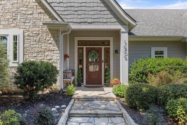 front view of a brick house with a large windows