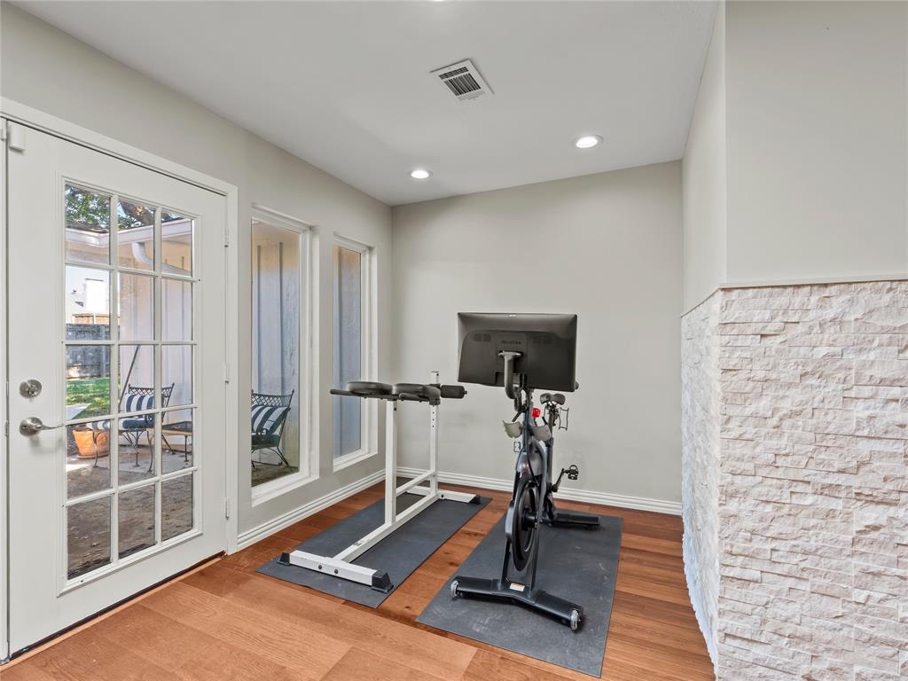 4707 Harvest Hill Road Dallas, TX 75244 - Photo 11 of 20 a view of a room with gym equipment
