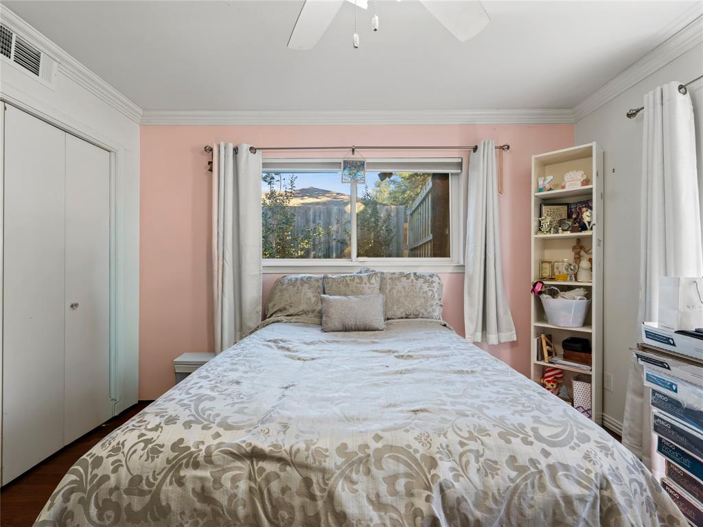 4707 Harvest Hill Road Dallas, TX 75244 - Photo 12 of 20 a bedroom with a large bed and a window