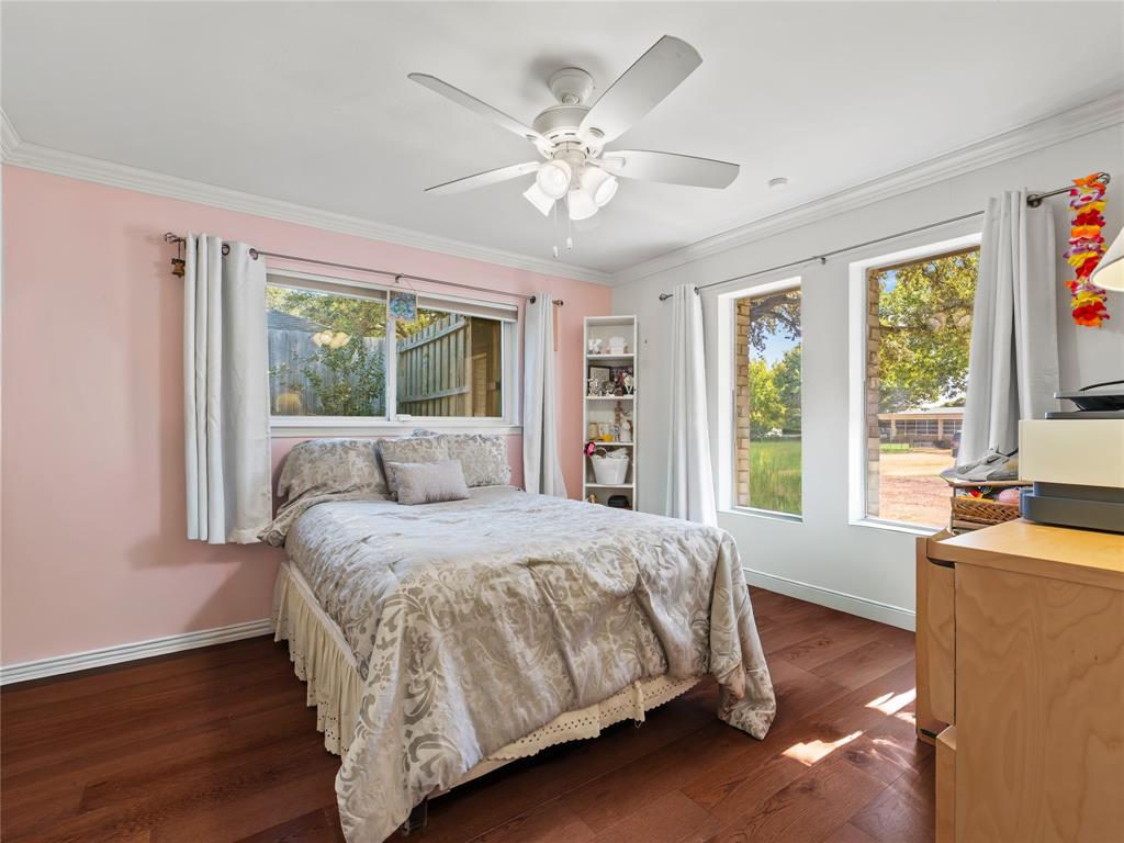 4707 Harvest Hill Road Dallas, TX 75244 - Photo 13 of 20 a bedroom with a large bed and a large window