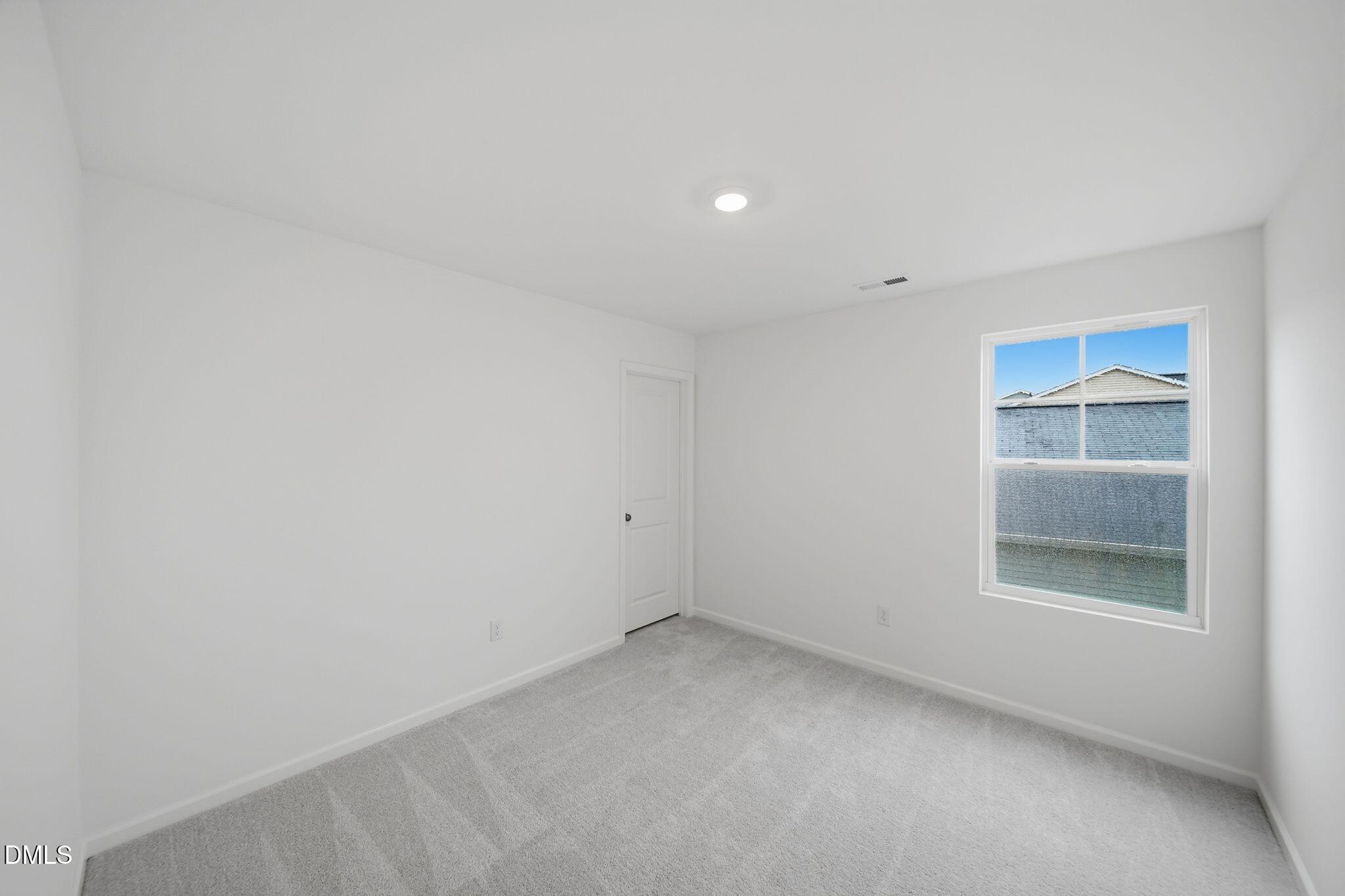5842 Millstone Way Sims, NC 27880 - Photo 16 of 22 a view of empty room with window
