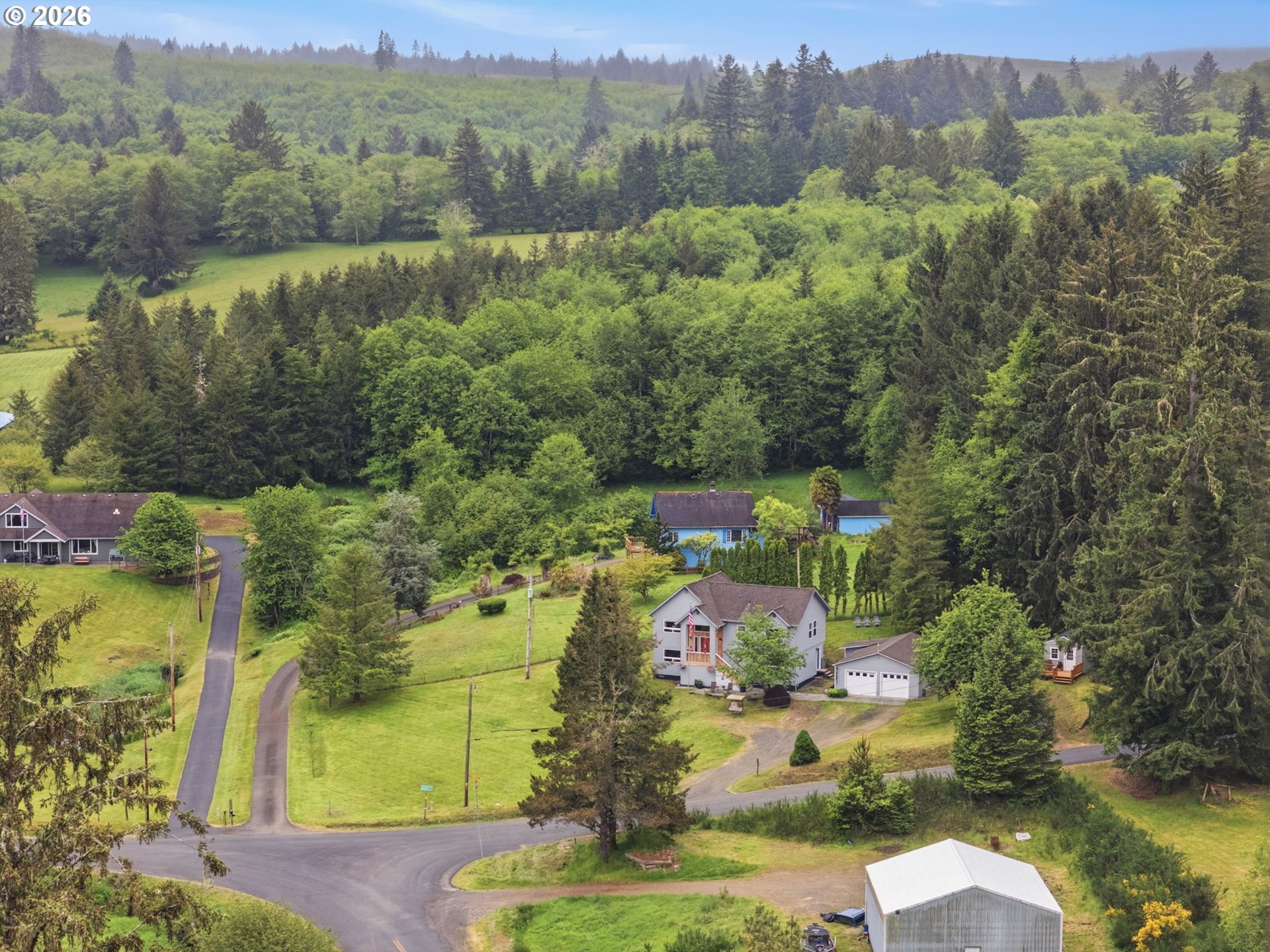 92085 Akerstedt Road Astoria, OR 97103 - Photo 3 of 48 an aerial view of a house with a yard