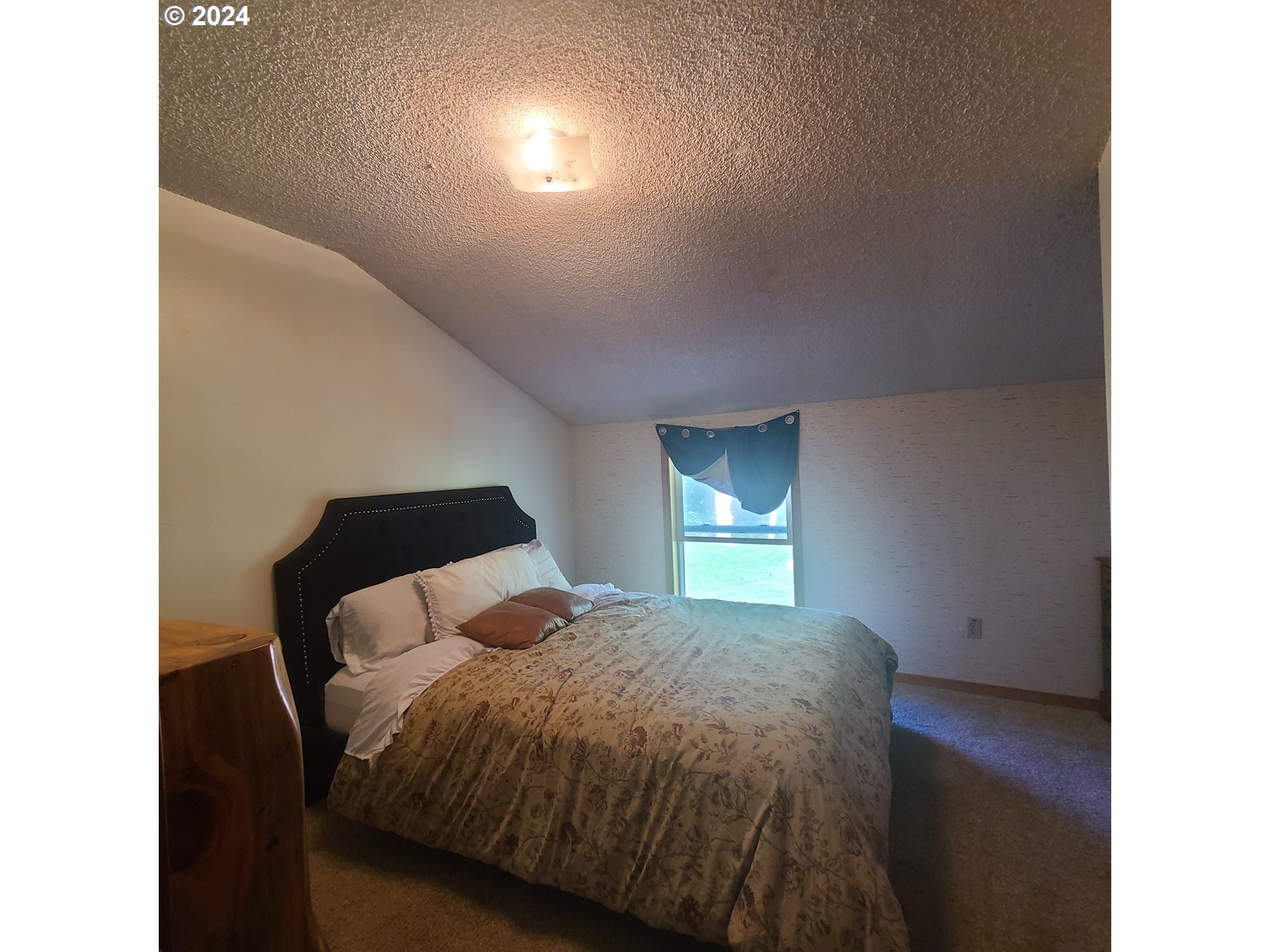 69867 Summerville Road Summerville, OR 97876 - Photo 26 of 48 a bedroom with a bed and a window