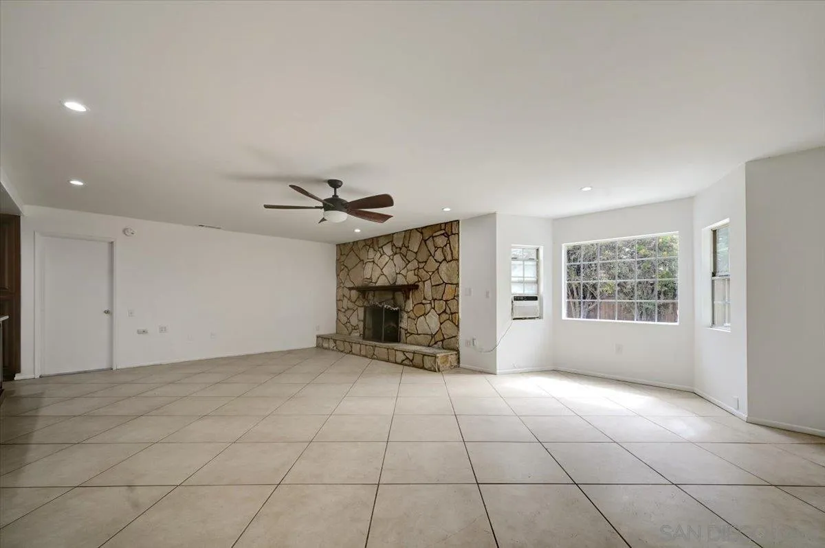 27335 Ventan Street Menifee, CA 92586 - Photo 15 of 36 an empty room with windows and fireplace