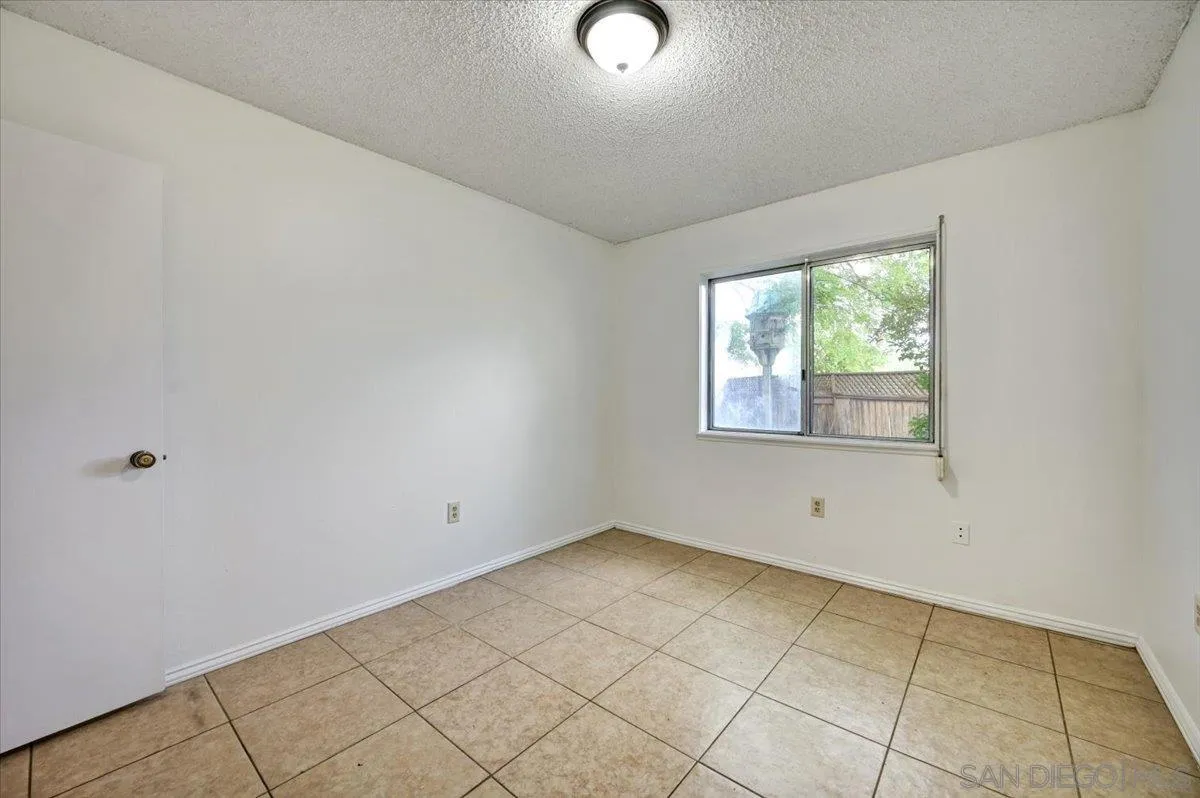 27335 Ventan Street Menifee, CA 92586 - Photo 17 of 36 a view of an empty room with a window