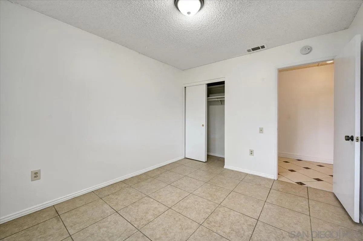 27335 Ventan Street Menifee, CA 92586 - Photo 18 of 36 an empty room with cabinet