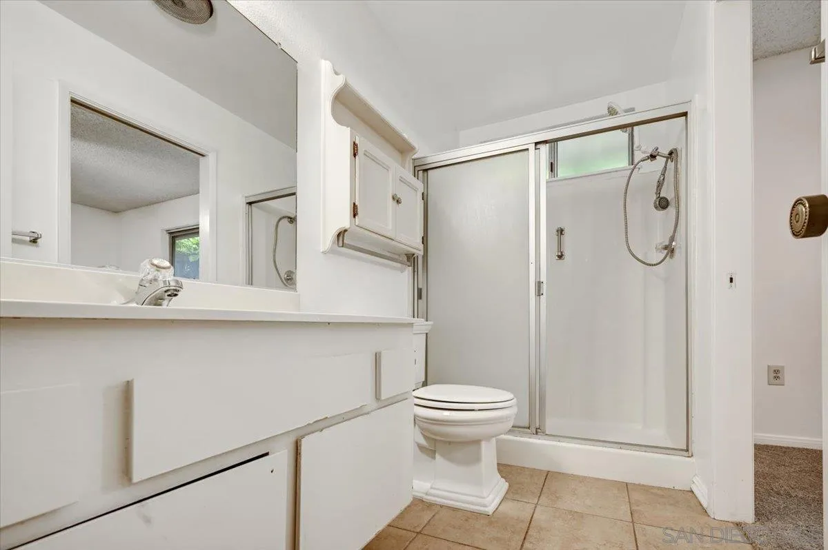 27335 Ventan Street Menifee, CA 92586 - Photo 24 of 36 a bathroom with a shower sink and toilet