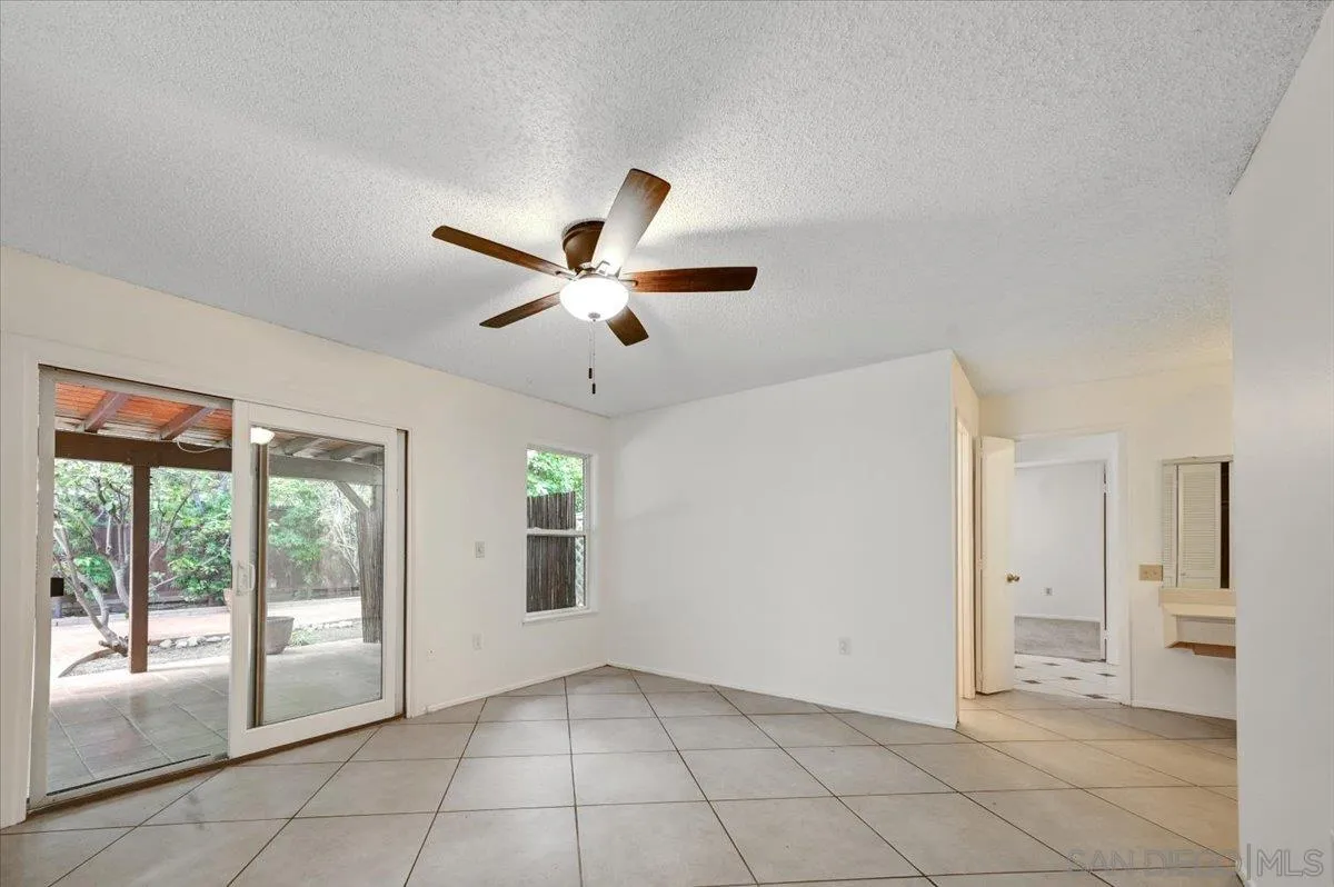 27335 Ventan Street Menifee, CA 92586 - Photo 26 of 36 a view of a livingroom with a chandelier fan and windows