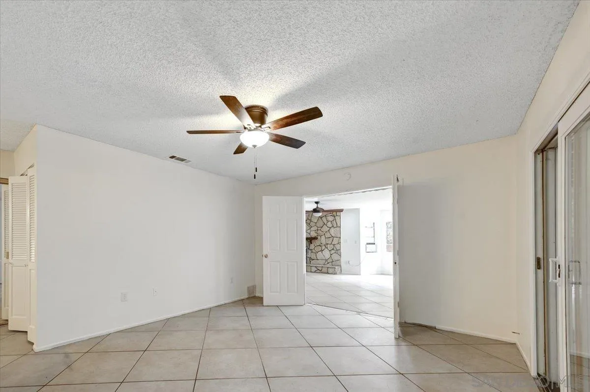 27335 Ventan Street Menifee, CA 92586 - Photo 27 of 36 a view of an empty room with a window