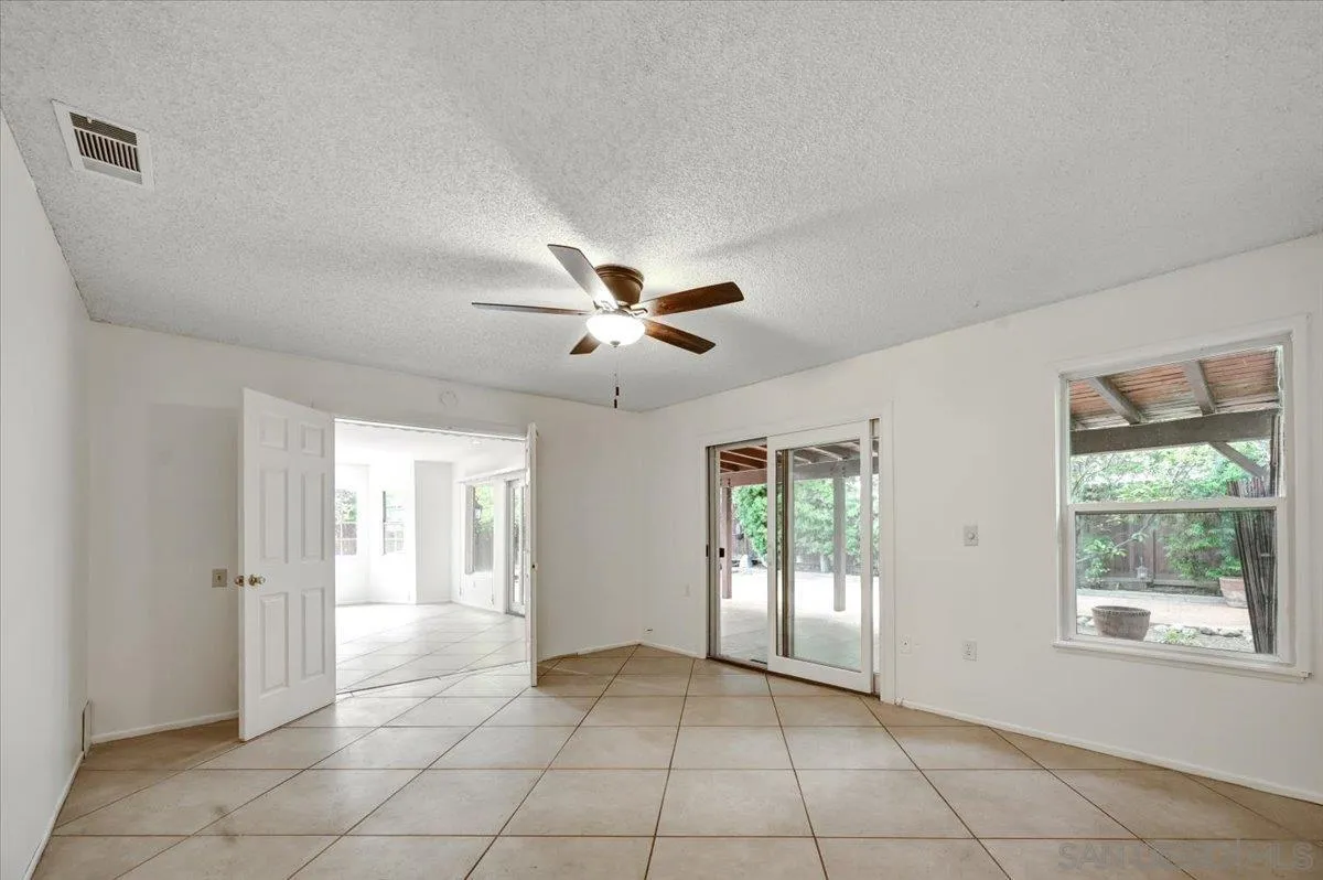 27335 Ventan Street Menifee, CA 92586 - Photo 29 of 36 a view of an empty room with a window
