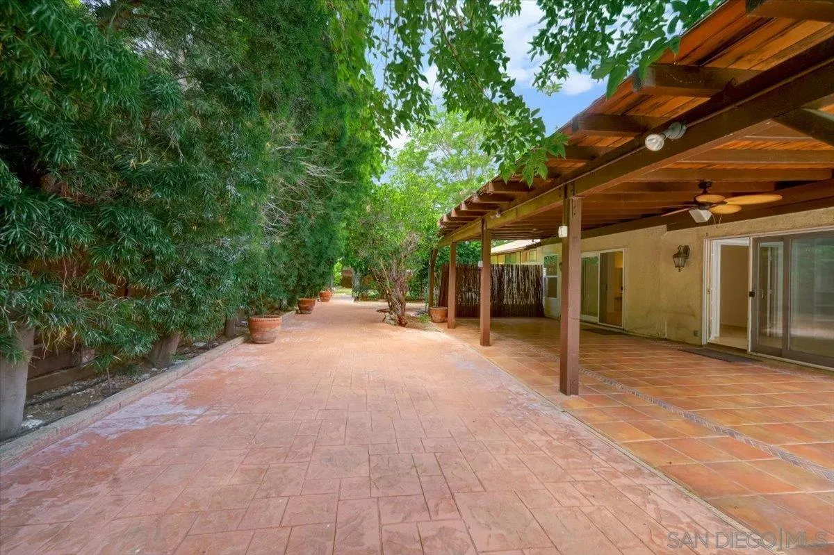 27335 Ventan Street Menifee, CA 92586 - Photo 32 of 36 a view of a house with backyard and tree