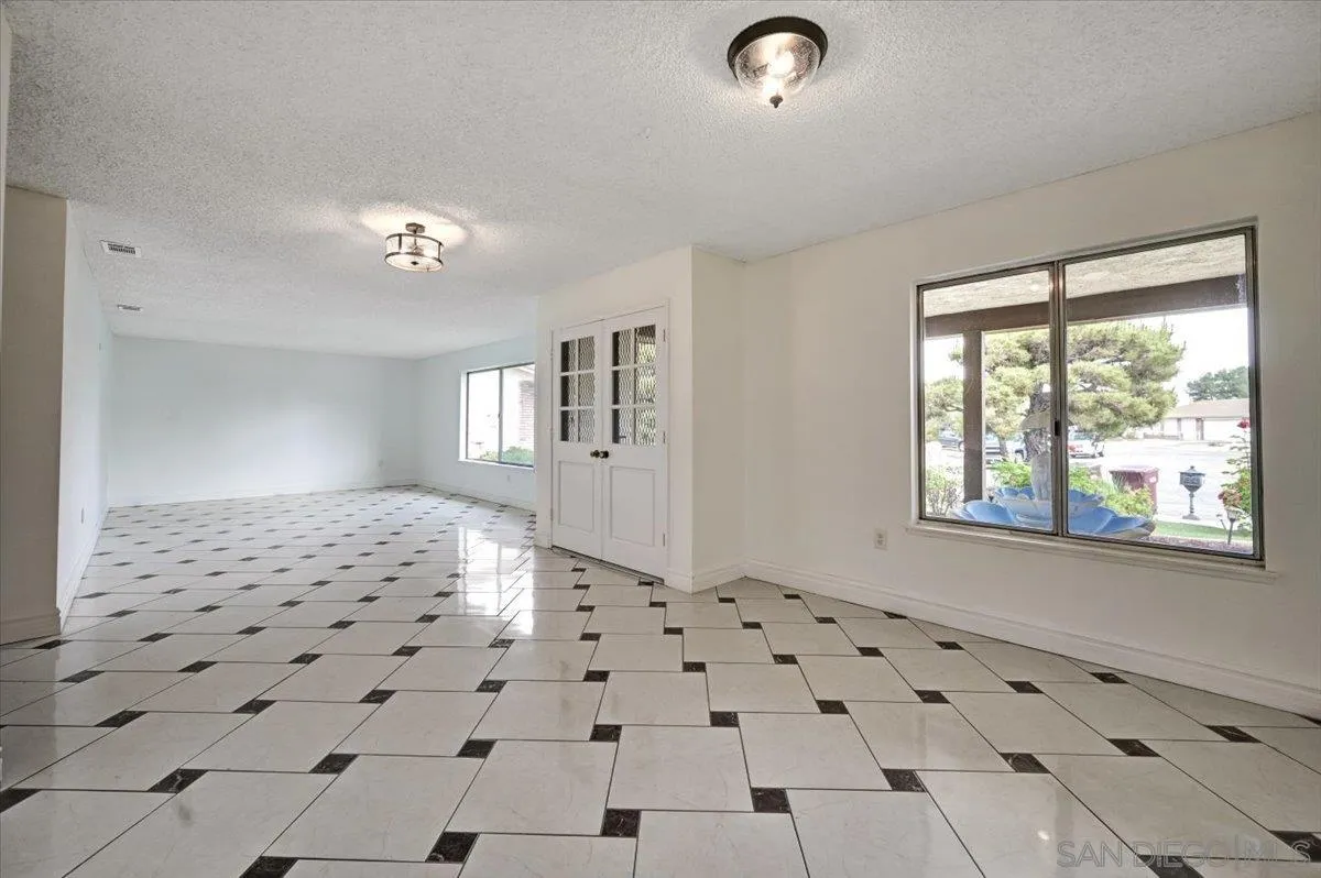 27335 Ventan Street Menifee, CA 92586 - Photo 9 of 36 a view of a livingroom with wooden floor and a window