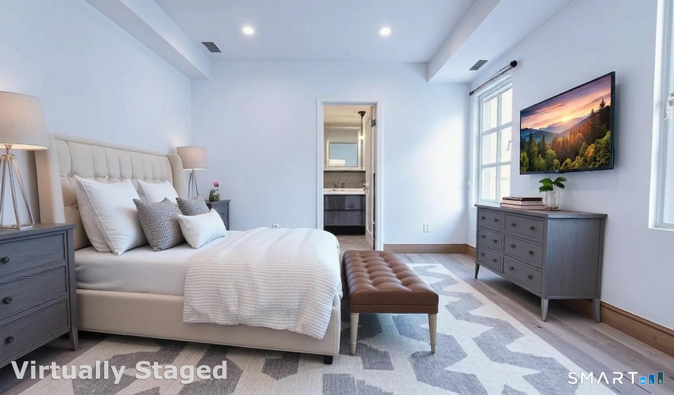930 Cove Road, Unit 3 Stamford, CT 06902 - Photo 4 of 9 a bedroom with a bed and a flat screen tv