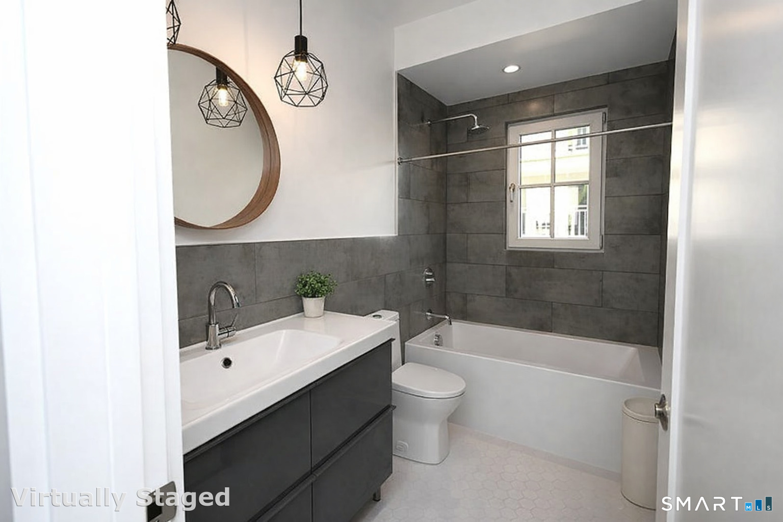 930 Cove Road, Unit 3 Stamford, CT 06902 - Photo 5 of 9 a bathroom with a sink a toilet and shower