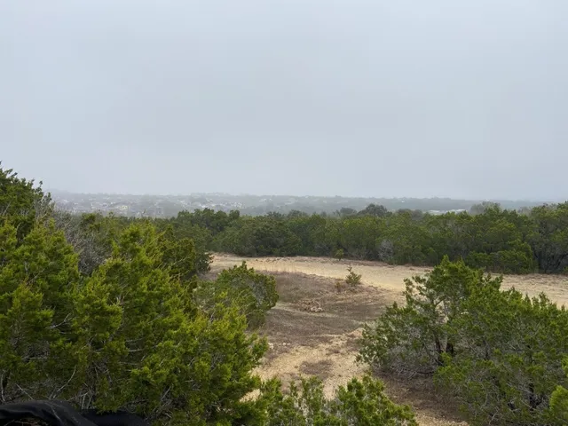 a view of lake with green space