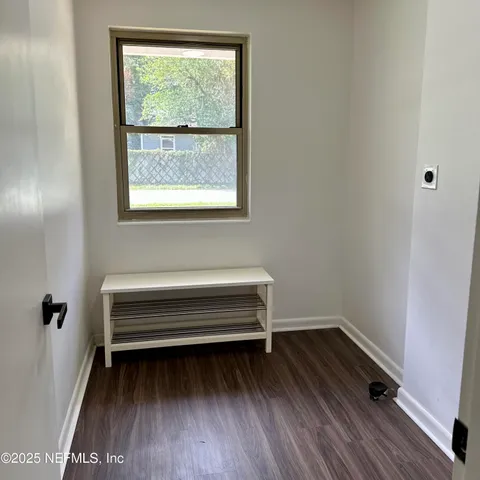 a storage room with wooden floor