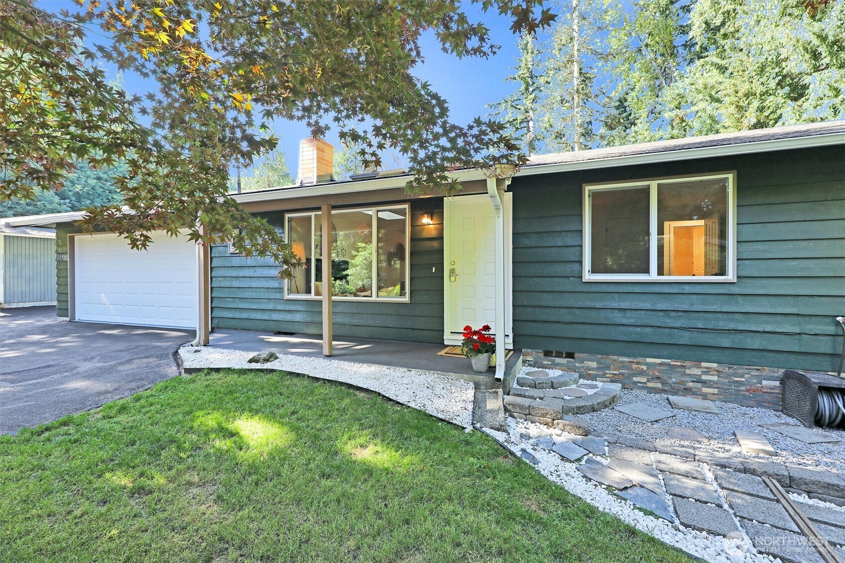 a front view of a house with garden