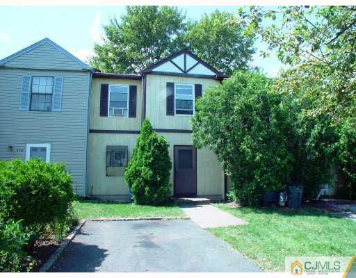 114 Redbud Road, Unit 114 Piscataway, NJ 08854 - Photo 2 of 7 a front view of a house with a yard and trees