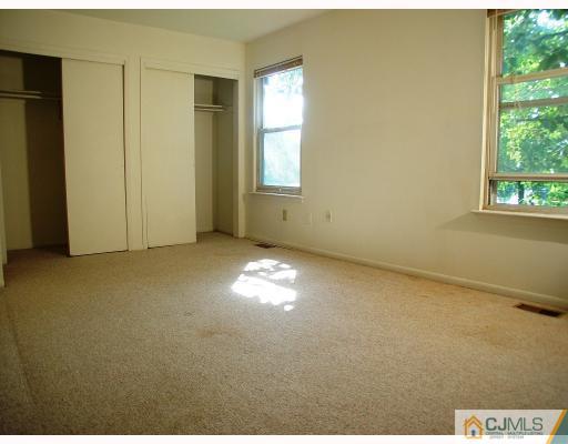 114 Redbud Road, Unit 114 Piscataway, NJ 08854 - Photo 5 of 7 a view of empty room with window